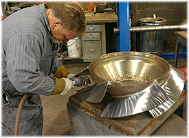 Man repairing a propeller.